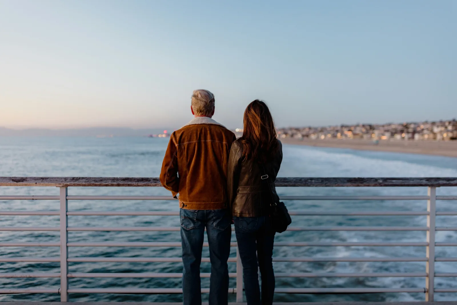 Retired couple enjoying the ocean view together